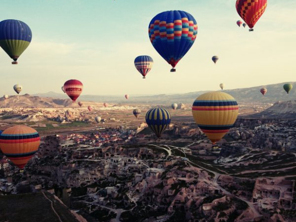 Spectacular hotair balloons take of in turkey against the Golden sky